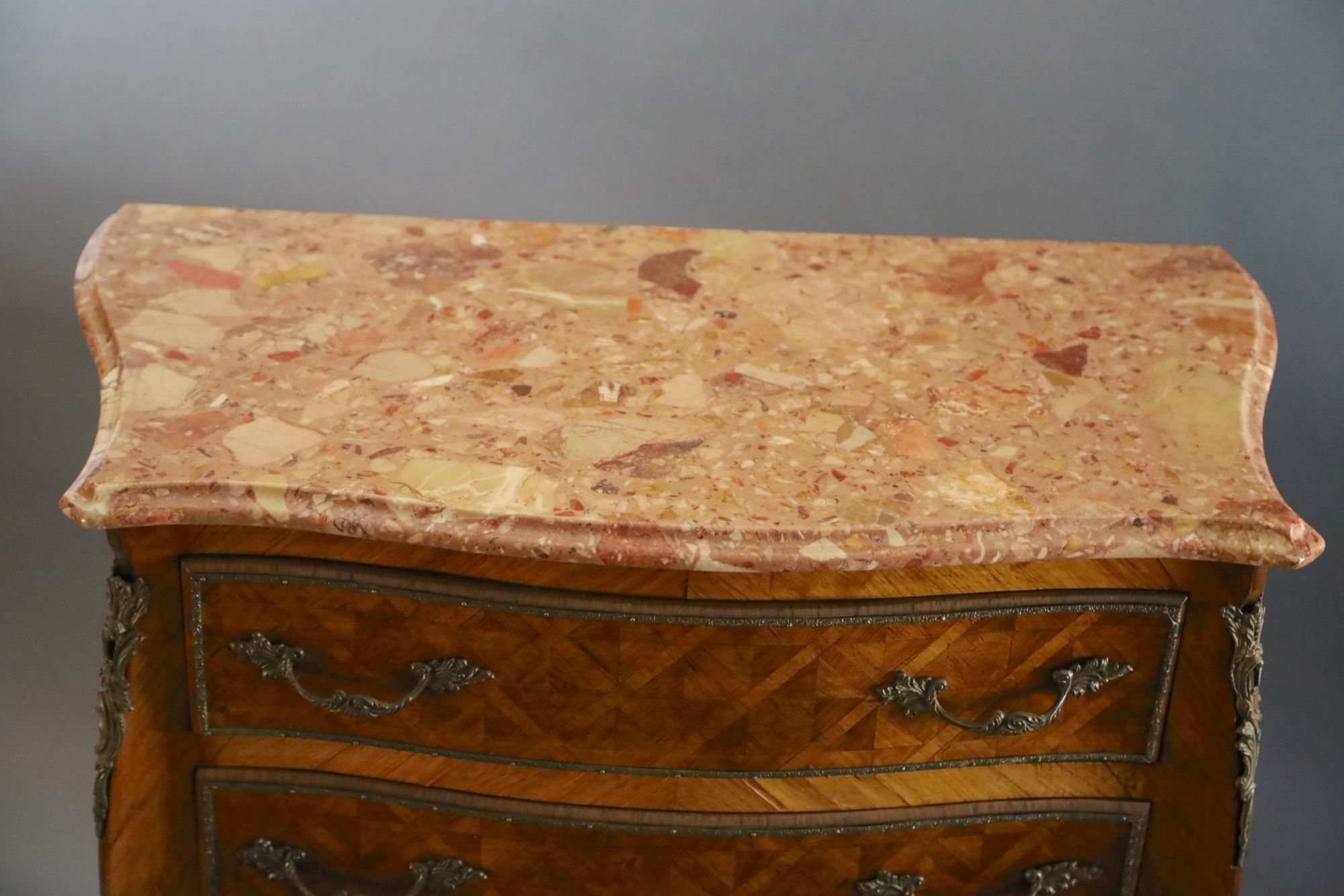 An early 20th century French Louis XVI style parquetry semanier, W.2ft 9in. D.1ft 5in. H.4ft 5in.